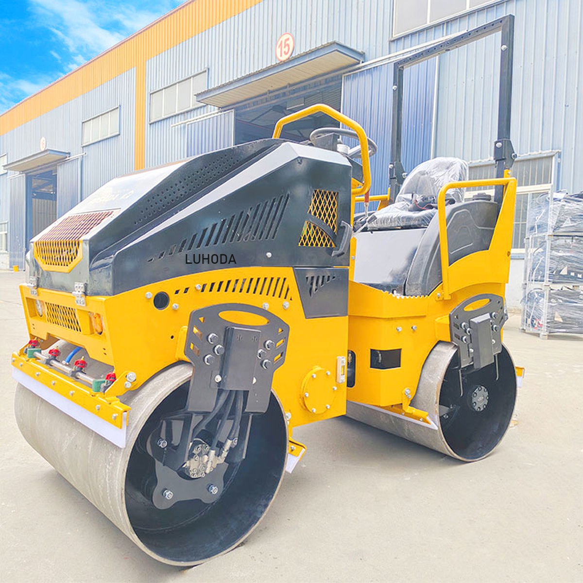 LHD-YL1100Plus 1100mm ride-on tandem vibratory road roller with LUHODA branding, full machine in three-quarter front view