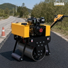 LHD-YL600 hand pull road roller compacting a freshly laid asphalt strip on a rural road