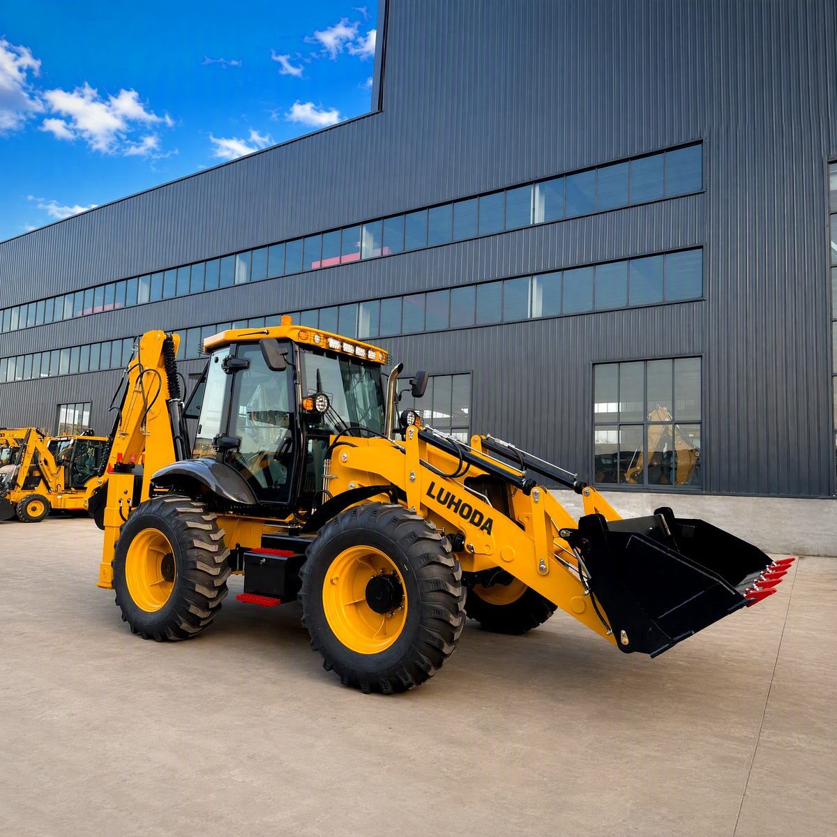 LHD-388H backhoe loader with LUHODA decal, full machine centred in side view on the paved yard at Shandong Luhongda Machinery