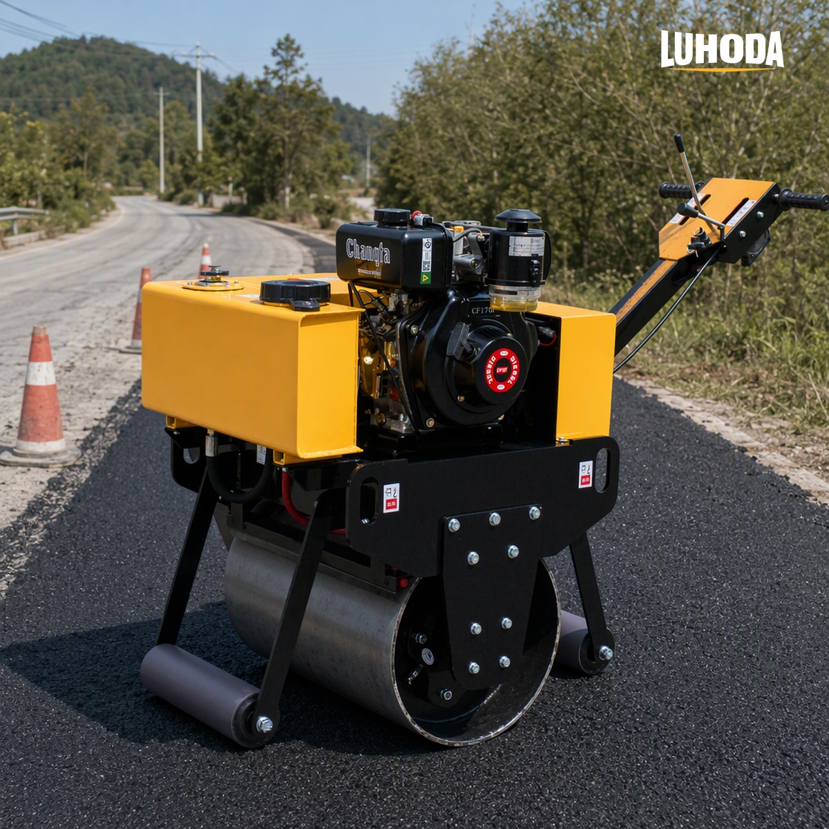 LHD-YL600 hand pull road roller compacting a freshly laid asphalt strip on a rural road